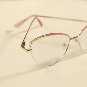 Closeup detail of the vintage cat-eye metal eyeglasses frame with chic pink wave accent.