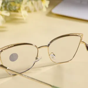 Gold metal cat-eye anti-blue light glasses detail view, stylish optical eyewear frame.