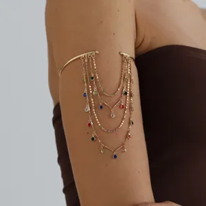 Gold multi-strand tassel upper arm cuff with colorful gemstones detail view for women.