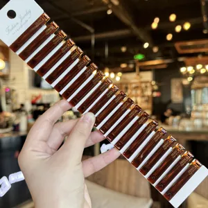 Close-up detail of acrylic hair clips in rich brown tortoiseshell color on a display card.