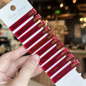Close up view of red acrylic duckbill hair clips set on white card, sleek side bangs clip detail.