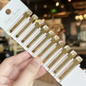 Transparent acrylic hair clips with gold label design, elegant side duckbill clips for daily wear.