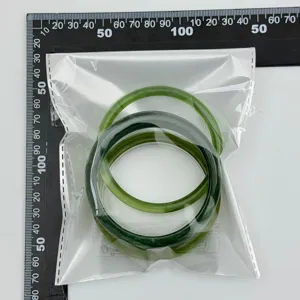 Fashionable transparent green resin bracelet set featuring a glossy smooth arc design.