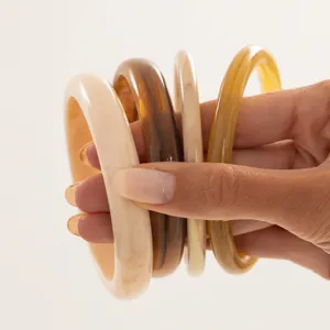 Trendy resin bracelet set featuring colorful gradient translucent stacked bangles for women chic style.