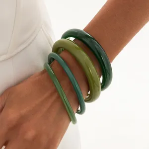 Trendy colorful marbled transparent resin bangles stacked design, glossy finish fashion jewelry.