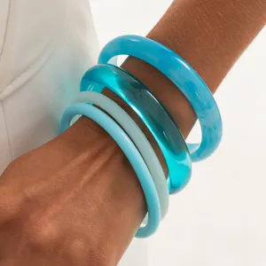 Chic blue resin bangle bracelet set, transparent dyed stacked wrist jewelry for women.