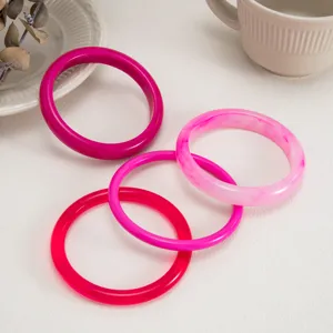Colorful transparent resin bracelet detail, smooth arc surface, fashionable stacked bangles.