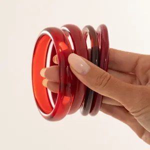 Red translucent resin bangles stack, stylish glossy stackable fashion bracelets for women.
