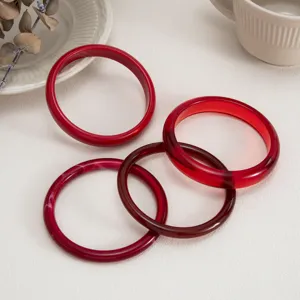 Red transparent resin bangles set, chic minimalist acrylic round bracelets for women daily wear.