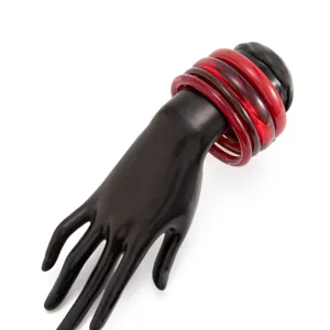 Transparent red resin bangles detail showcasing stacked glossy smooth arc design for women fashion.