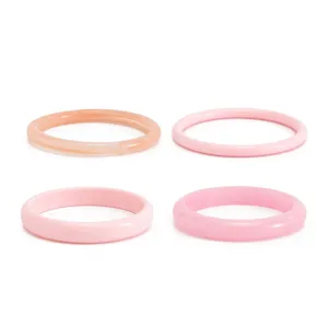 Resin bangle set detail showcasing smooth pink and marbled textures for trendy fashion looks.
