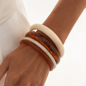 Detail shot of colorful stackable resin bangles featuring smooth arc design for women fashion.