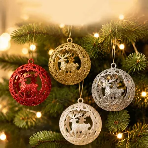 Close-up of glittering Christmas tree balls with hollow reindeer design and warm lights.