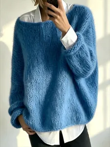 Blue mohair knit sweater detail, loose lazy style pullover top with white shirt layer.