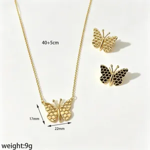 Gold butterfly necklace and earrings jewelry set with honeycomb texture, elegant chain.