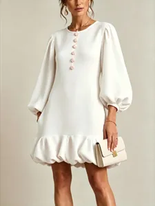Detail view of the elegant lantern sleeve mini dress with floral buttons and bubble hem.