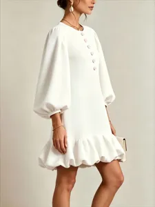 Elegant white mini dress with bishop sleeves, floral buttons and ruffled hem for women.