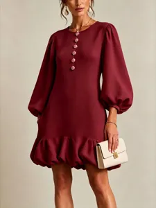 Burgundy long sleeve dress with floral buttons, loose fit, and elegant ruffle hem detail.