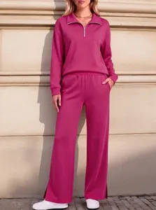 Detailed shot of the pink half-zipper sweatshirt and matching wide leg pants lounge set.