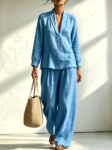 Detail view of casual two-piece set, stylish long sleeve v-neck shirt and wide pants.