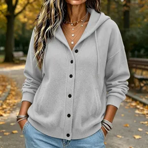 Grey knit hooded cardigan detail, casual autumn button-up sweater outerwear style.