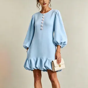 Light blue crew neck long sleeve dress featuring cute floral buttons and chic ruffle bubble hem.