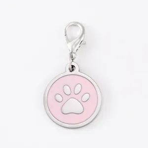 Close-up detail of the pink enamel dog paw pendant with lobster clasp and stainless steel.