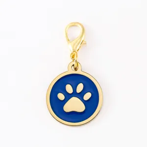 Gold lobster clasp blue enamel dog paw pendant detail view, metal DIY pet ID tag charm.