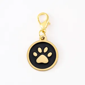Stainless steel dog paw pendant keychain with lobster clasp, durable metal pet ID tag charm.