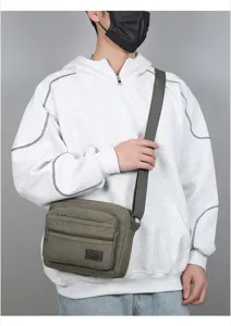 Men's multi-layer canvas shoulder bag, casual commuter crossbody bag with multiple zip pockets.