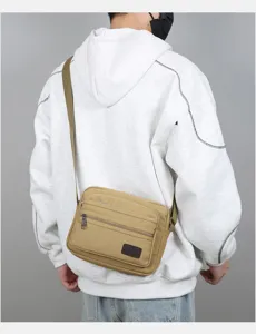 Men's multi-layer canvas shoulder bag casual business commuter crossbody bag detail view.