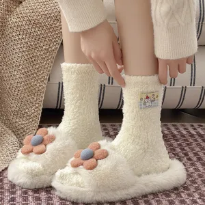 Cozy coral fleece fuzzy socks for women with plush flower slippers, perfect for winter.