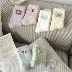 Thick coral fleece socks for women, cozy winter plush sleep floor socks with cute cartoon patches.