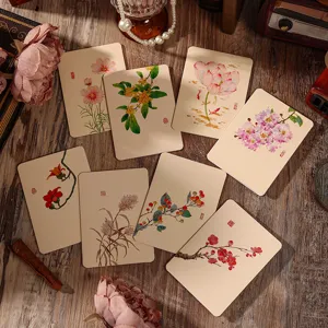 Close-up view of traditional Chinese vintage floral greeting cards with artistic ink art designs.