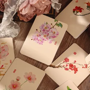 Detailed view of vintage Chinese style floral greeting cards with delicate watercolor illustrations on paper.