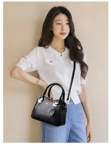 Elegant black leather handbag for women, top-handle shoulder crossbody bag with strap.