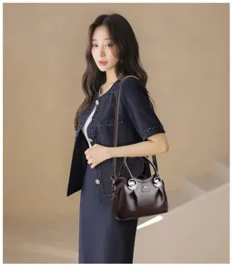 Elegant women's leather handbag, classic top handle shoulder bag and crossbody bag style.