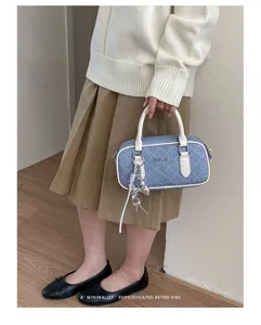 Chic quilted denim handbag with top handles, stylish shoulder pillow bag for women.