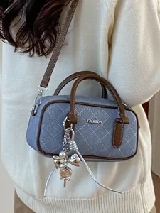 Blue quilted denim pillow bag for women, stylish casual crossbody and handbag design.