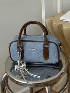 Stylish denim quilted handbag for women, chic commuting top handle shoulder pillow bag.