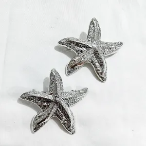 Silver starfish hair clip metal barrette detail view, elegant back head hair accessory.