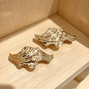 Gold wave hair clip spring hair accessory detail view, elegant metal hairpin for women.