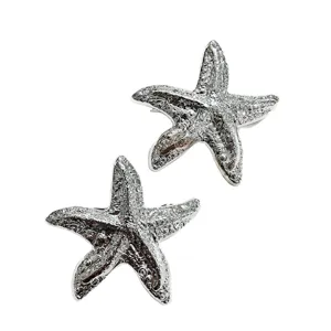 Silver starfish hair clip, elegant metallic barrette for women, versatile spring hair accessory.