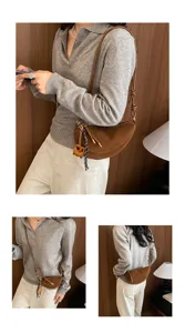 Retro brown suede crescent shoulder bag for women, chic half-moon crossbody bag with charm.