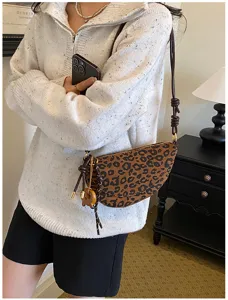 Detail view of a retro suede leopard print crescent shoulder bag for women, chic design.