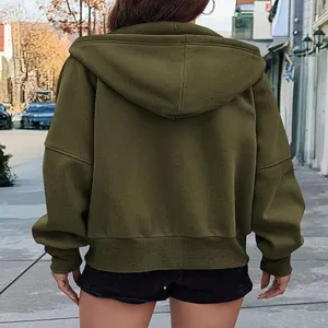 Back view of the olive green zip-up hooded sweatshirt showcasing its cropped fit and sleeves.