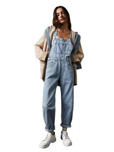 Casual loose washed denim overalls for women with pockets and stylish layered outfit look.