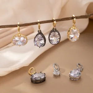 Vista detallada de dijes de joyería DIY de circonita brillante, piezas de óvalo y lágrima.