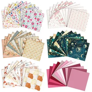 Scrapbook paper detail view showing various floral, celestial and solid colored background sheets.