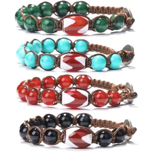Handmade woven gemstone bracelet with central Dzi bead, multi-color bead detail view.